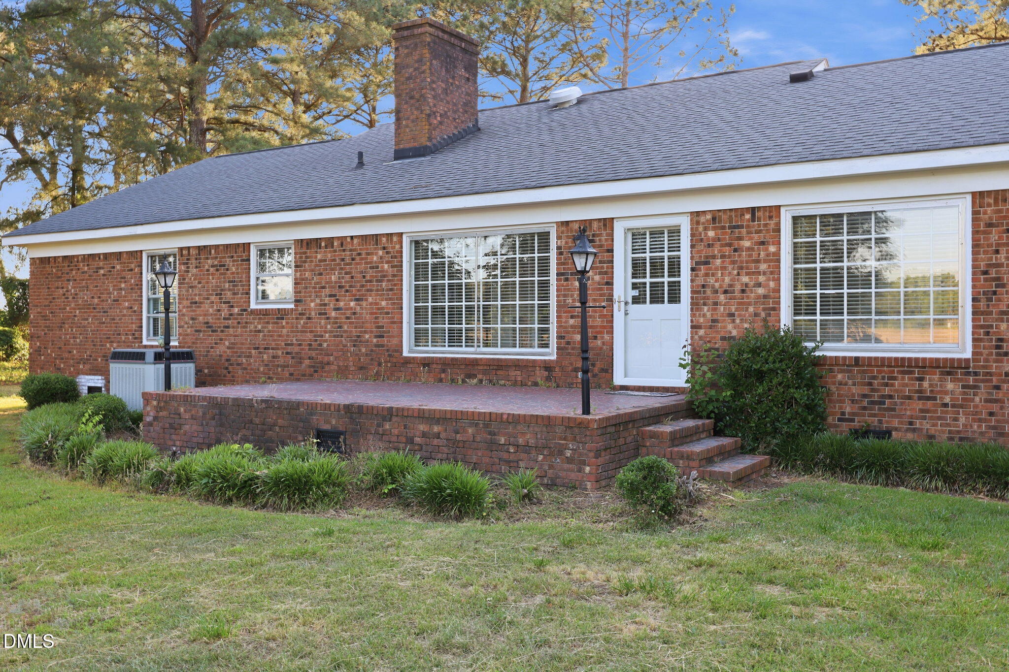 1130 Prospect Church Road Dunn, NC 28334 - Photo 4 of 47 a front view of a house with garden