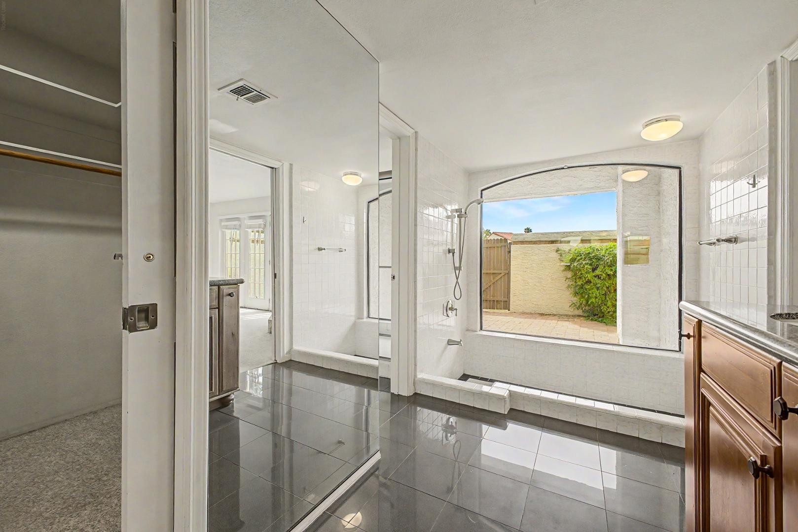 5736 North 25th Street Phoenix, AZ 85016 - Photo 15 of 59 a bathroom with a tub and shower