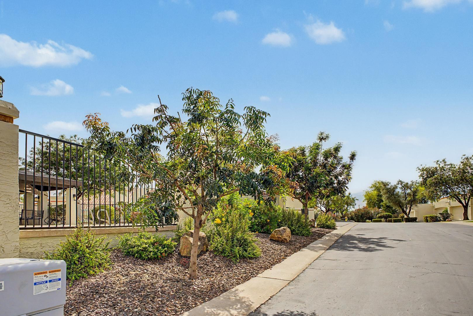 5736 North 25th Street Phoenix, AZ 85016 - Photo 45 of 59 a view of a garden with a building in the background