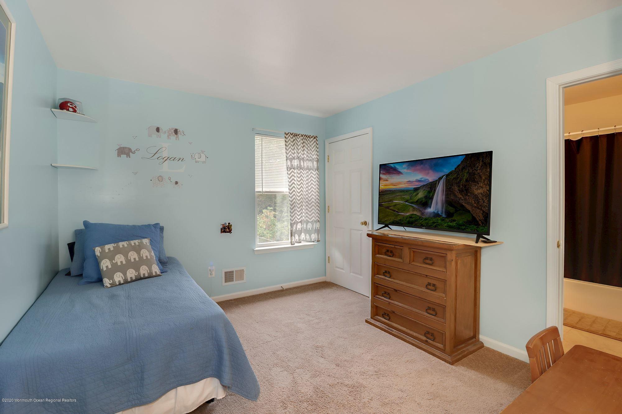 1403 Reed Road Cream Ridge, NJ 08514 - Photo 19 of 31 a living room with furniture and a flat screen tv