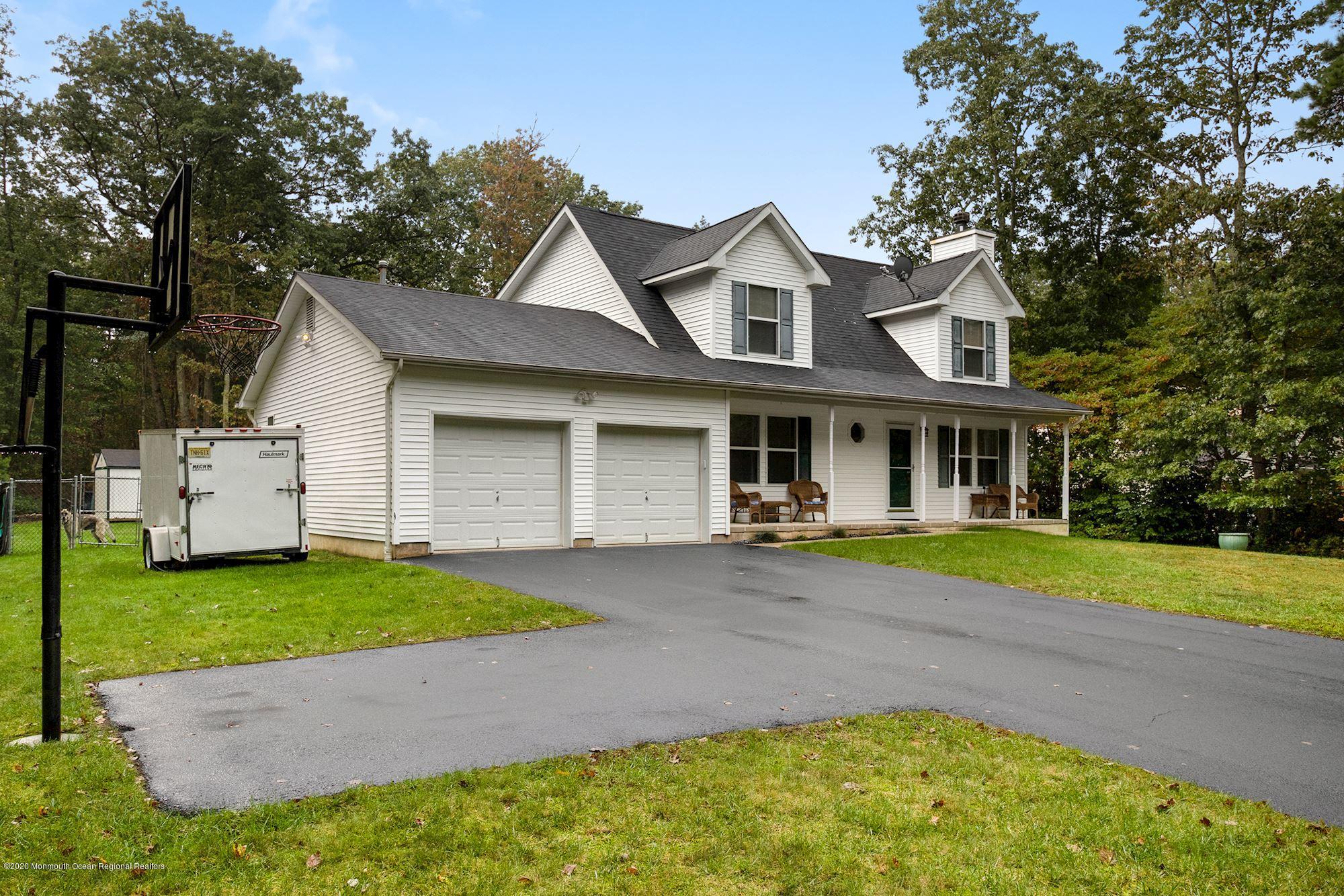 1403 Reed Road Cream Ridge, NJ 08514 - Photo 2 of 31 a front view of a house with a yard and porch