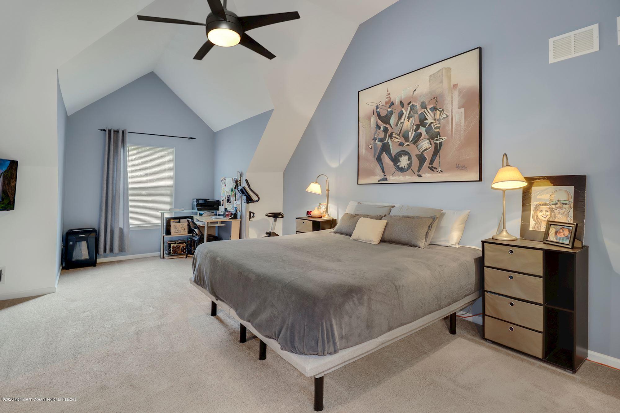 1403 Reed Road Cream Ridge, NJ 08514 - Photo 21 of 31 a bed room with a bed and dresser