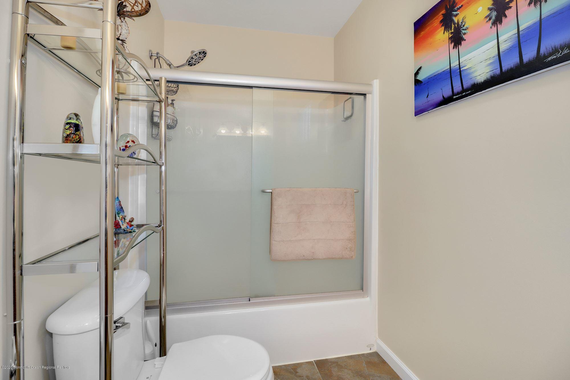 1403 Reed Road Cream Ridge, NJ 08514 - Photo 22 of 31 a bathroom with a shower a toilet and a shower