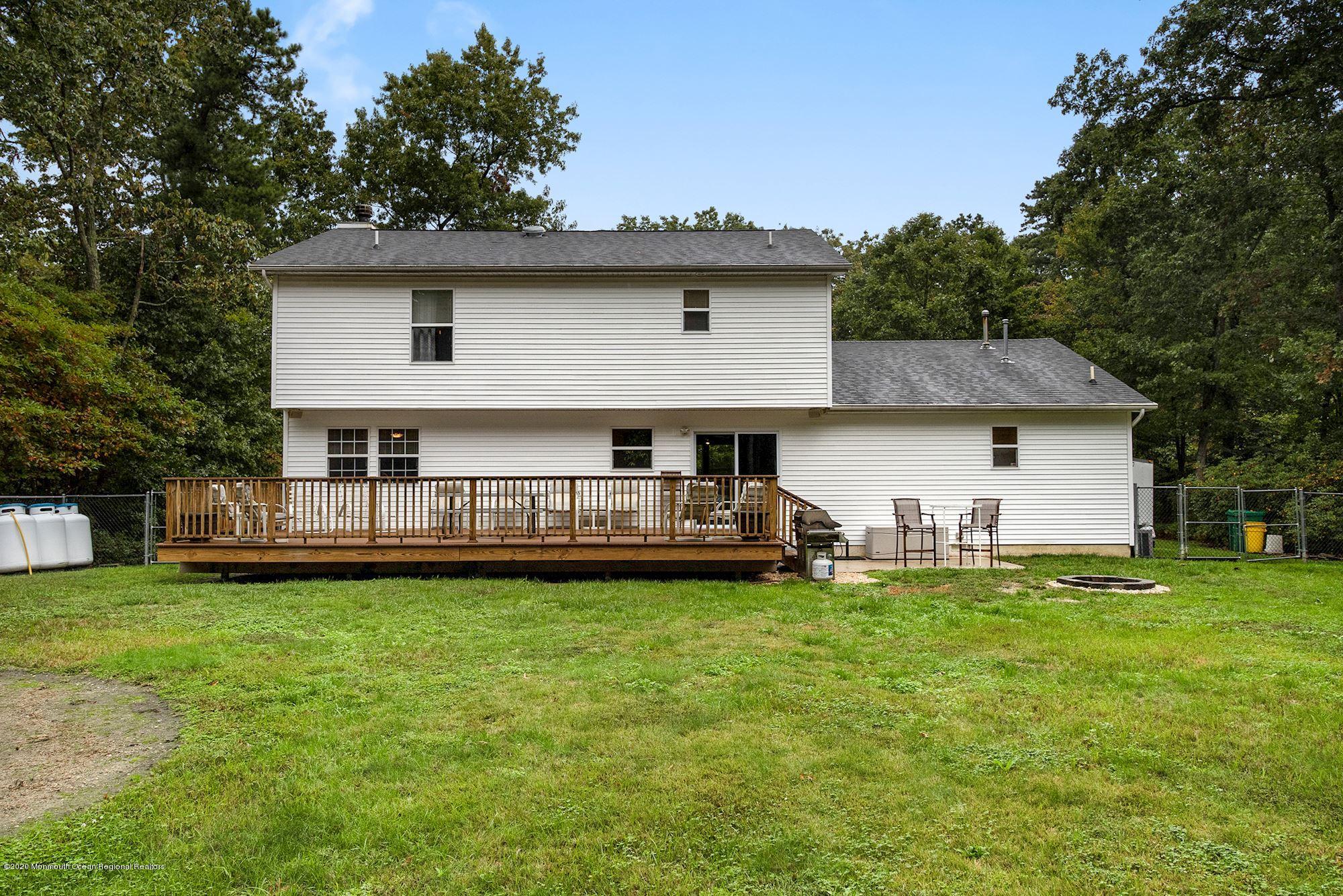 1403 Reed Road Cream Ridge, NJ 08514 - Photo 24 of 31 a view of a house with a yard and sitting area