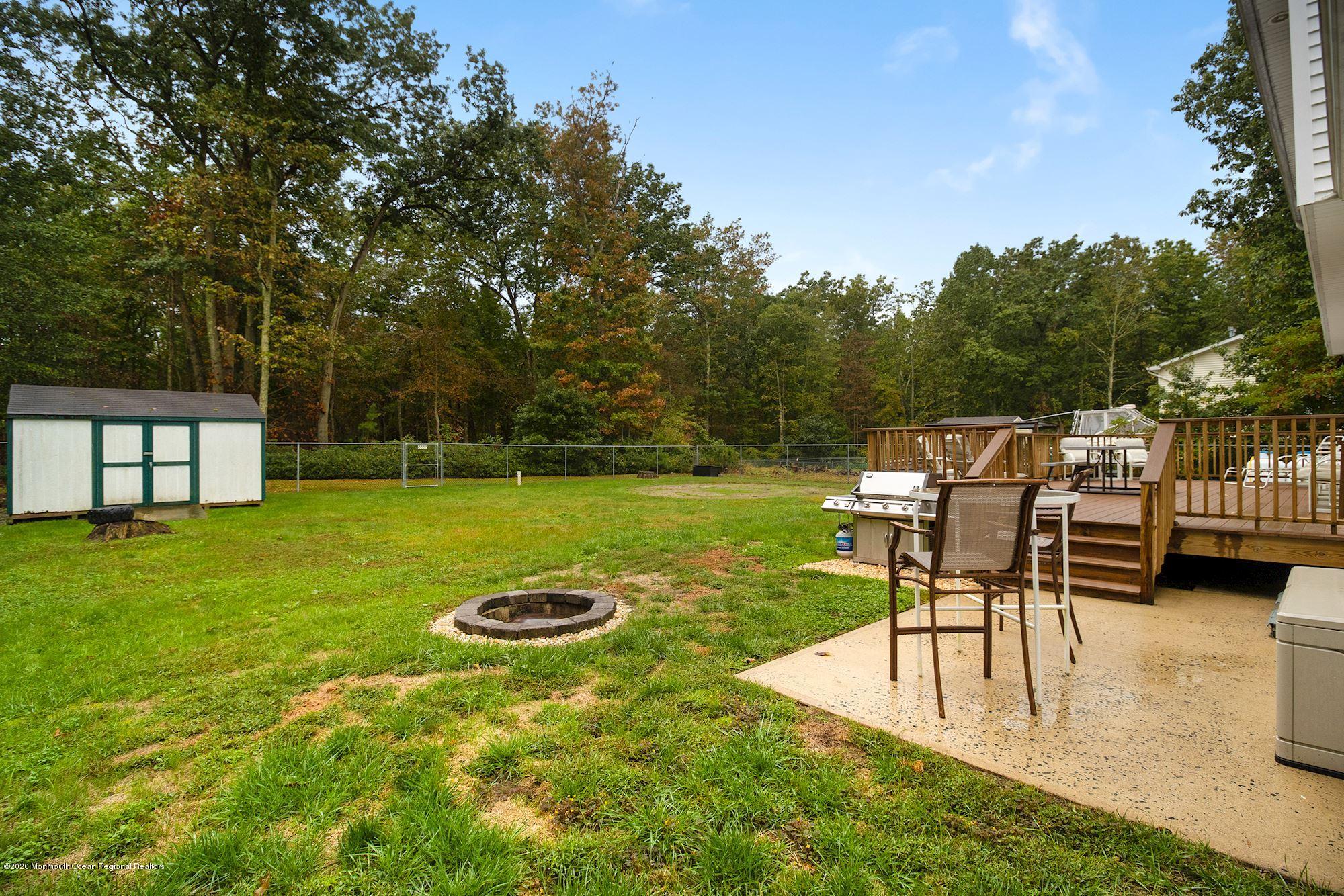 1403 Reed Road Cream Ridge, NJ 08514 - Photo 26 of 31 a view of a swimming pool with a table and chairs