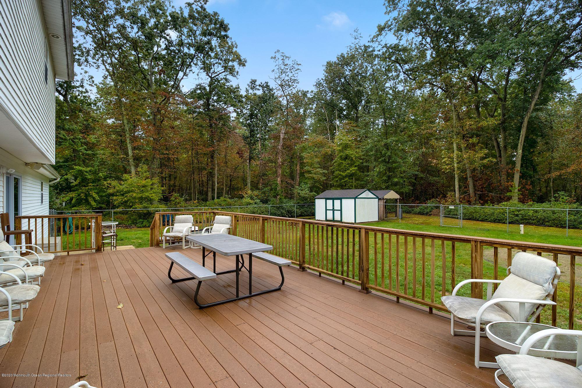 1403 Reed Road Cream Ridge, NJ 08514 - Photo 28 of 31 a view of a chair and table on the wooden floor