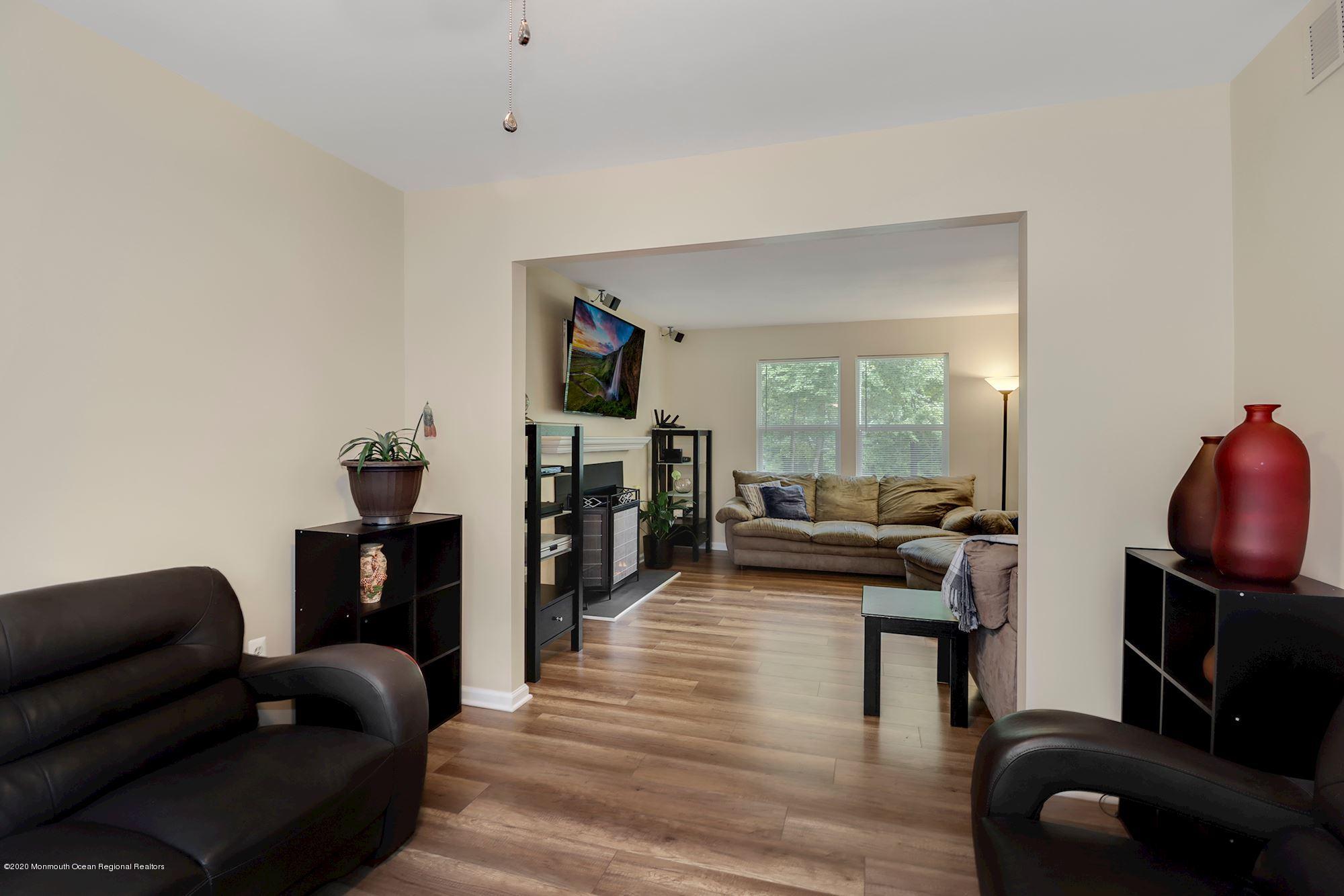 1403 Reed Road Cream Ridge, NJ 08514 - Photo 7 of 31 a living room with furniture and a flat screen tv