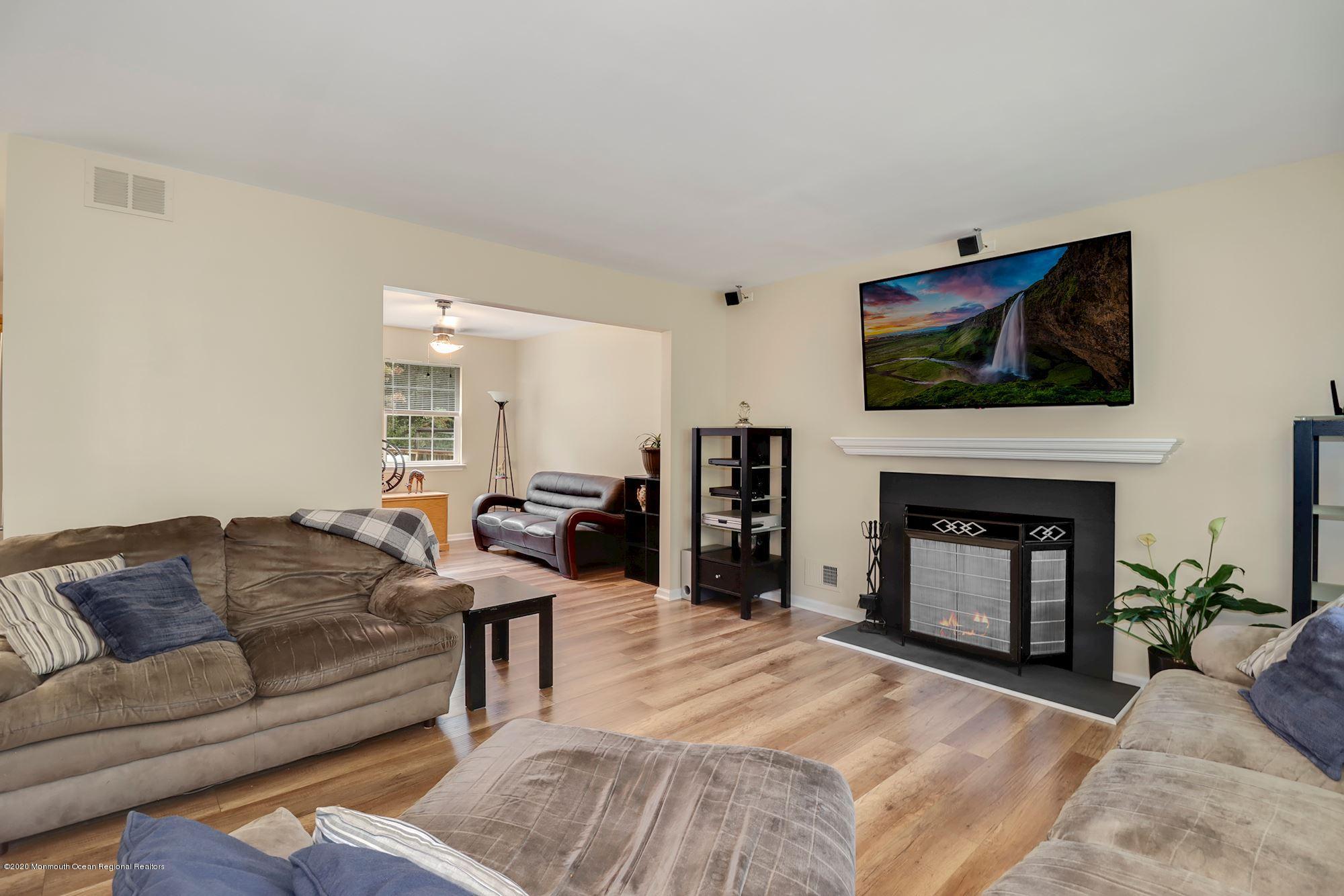 1403 Reed Road Cream Ridge, NJ 08514 - Photo 8 of 31 a living room with furniture and a fireplace