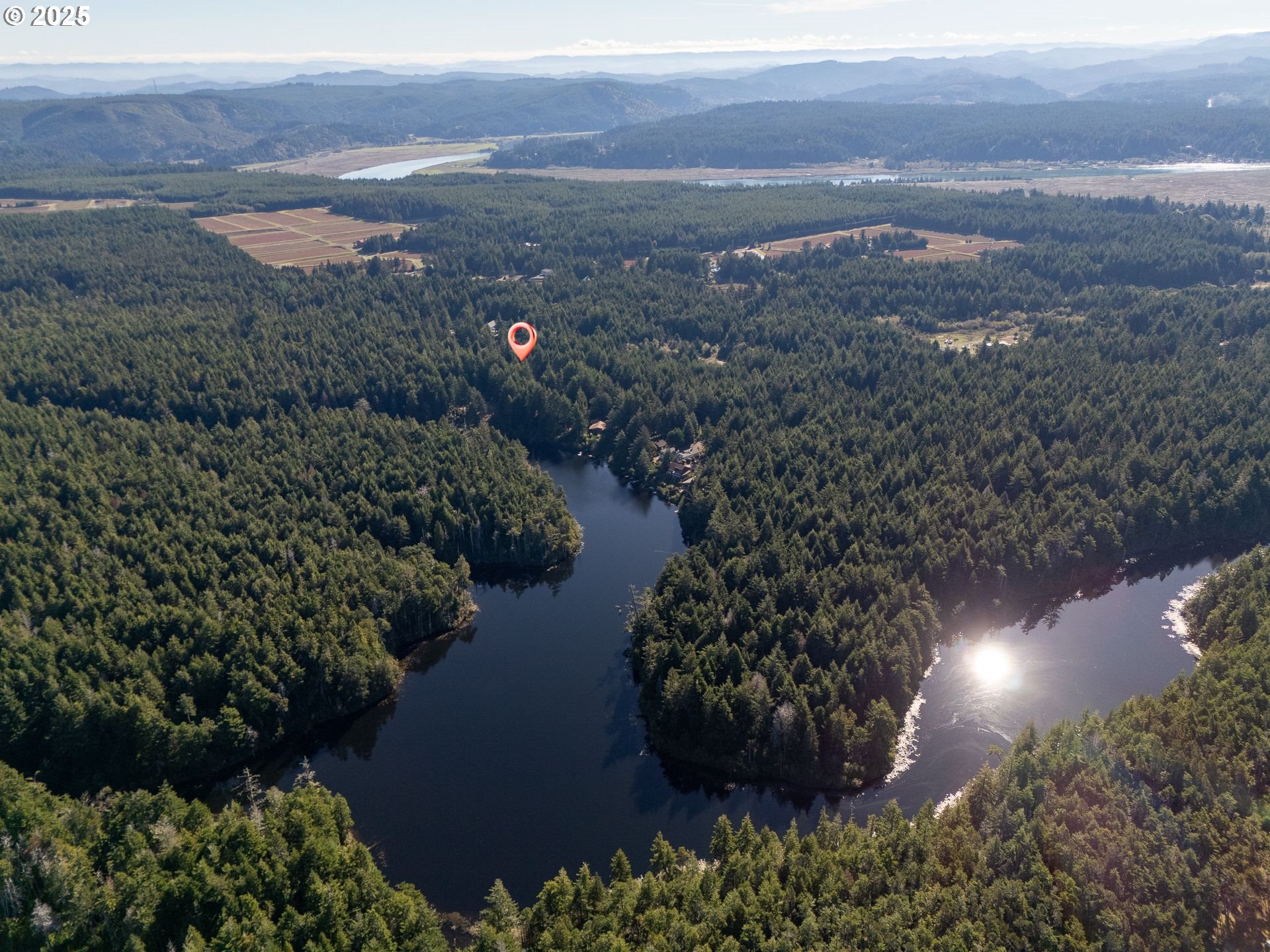 88629 Weiss Estate Road Bandon, OR 97411 - Photo 6 of 25 a view of lake and mountain in the back