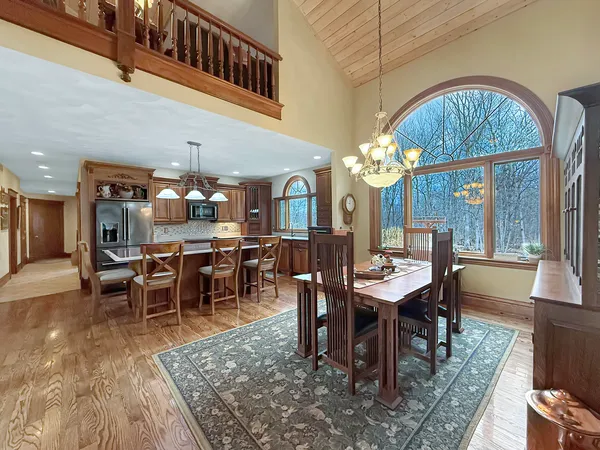 a living room with fireplace furniture and a chandelier