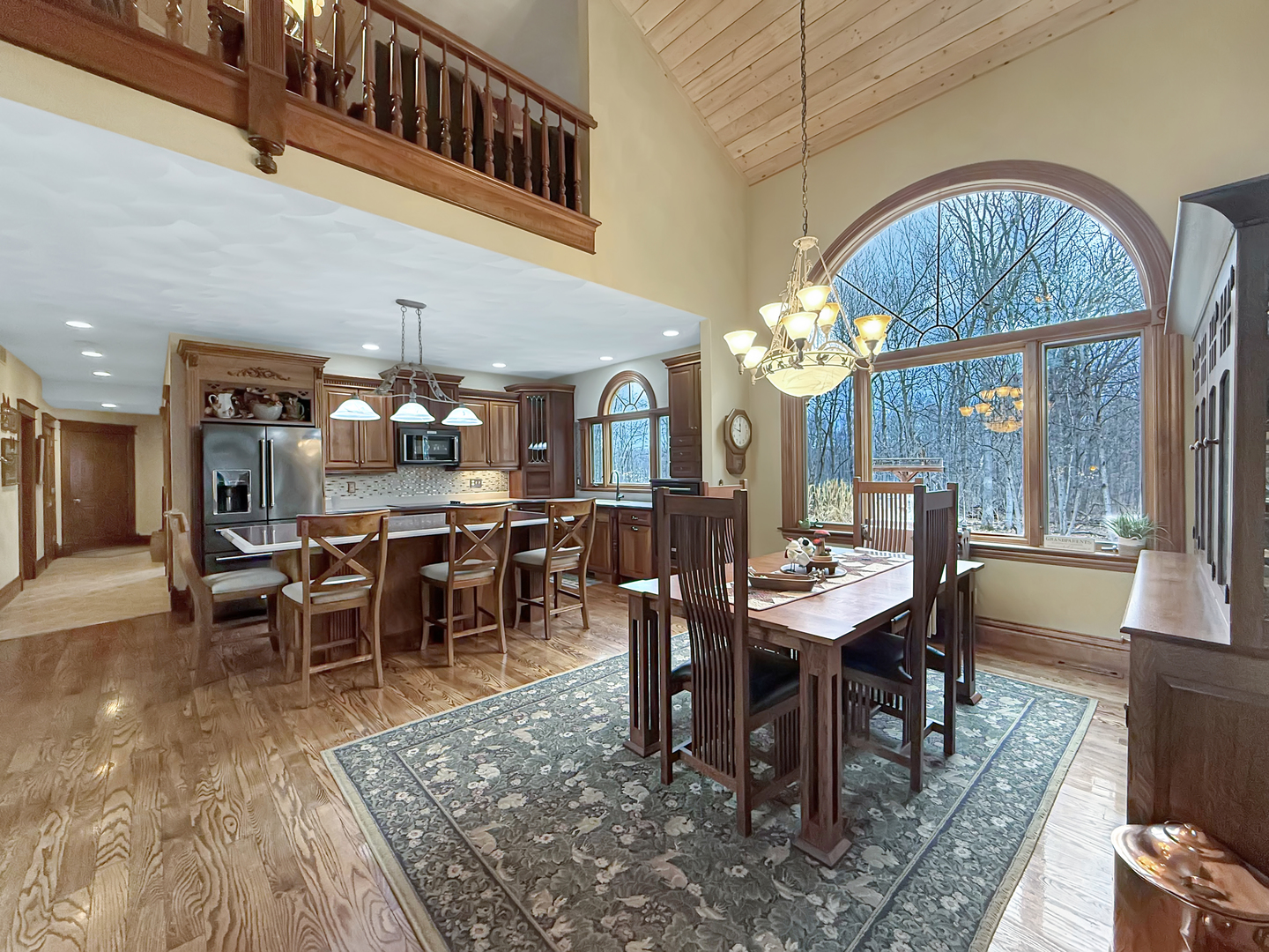 11307 Timber Lane Lena, IL 61048 - Photo 15 of 85 a view of a dining room with furniture a chandelier and wooden floor