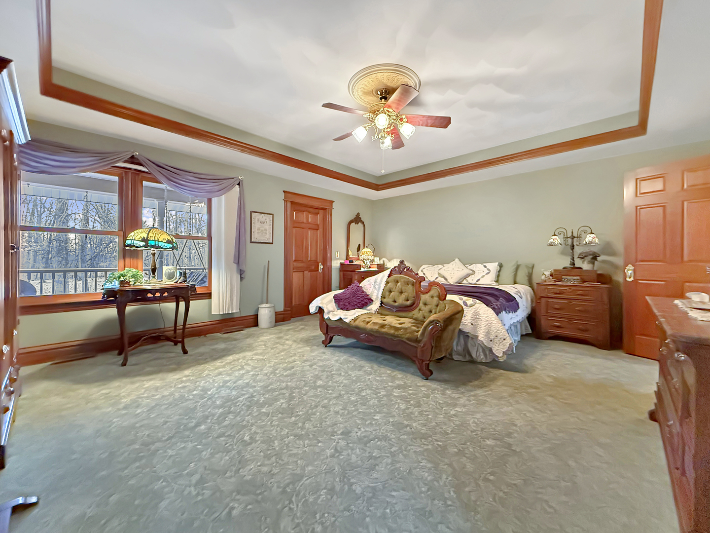 11307 Timber Lane Lena, IL 61048 - Photo 29 of 85 a spacious bedroom with a bed and a chandelier