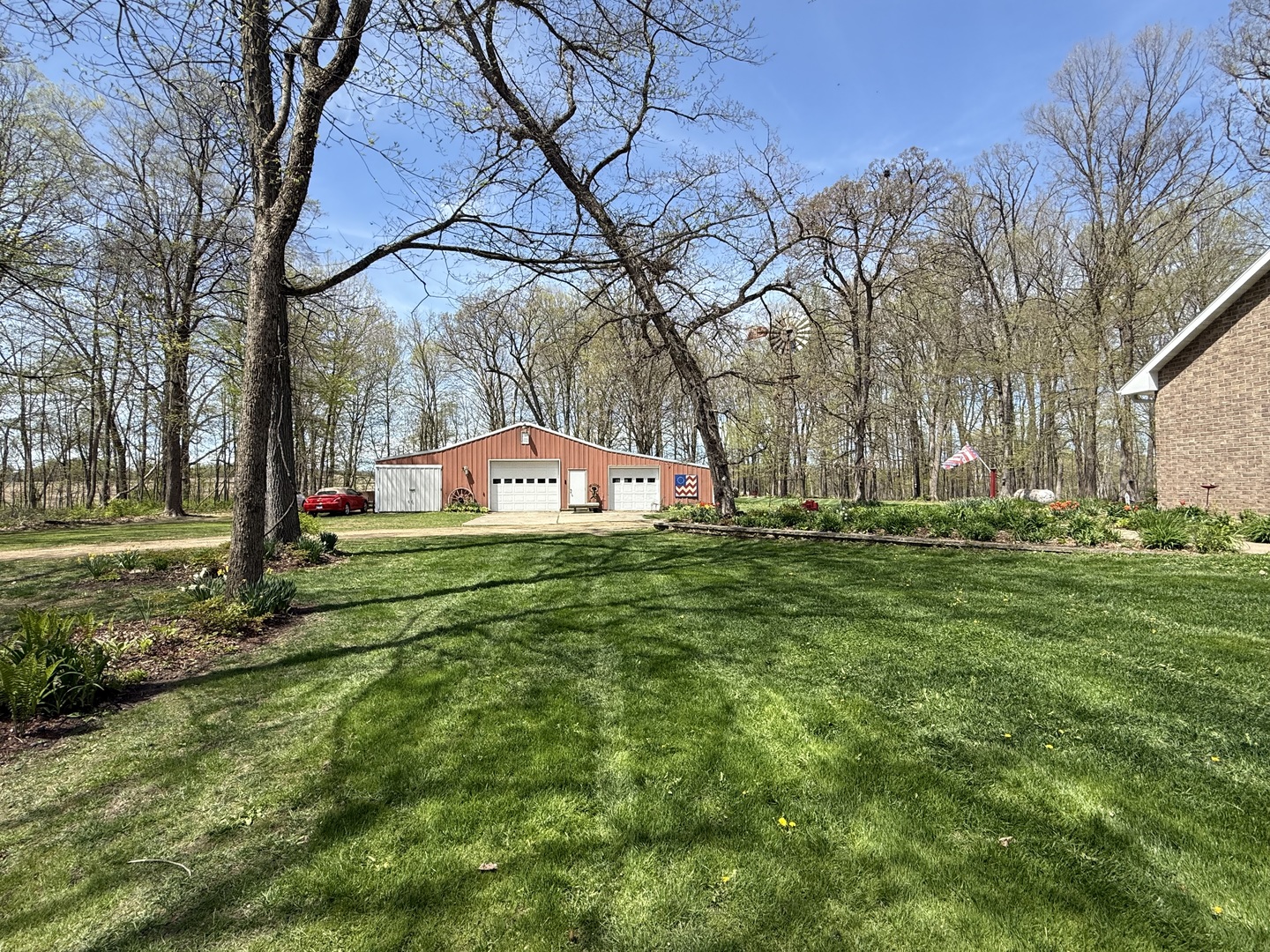 11307 Timber Lane Lena, IL 61048 - Photo 3 of 85 a front view of a house with a yard table and chairs