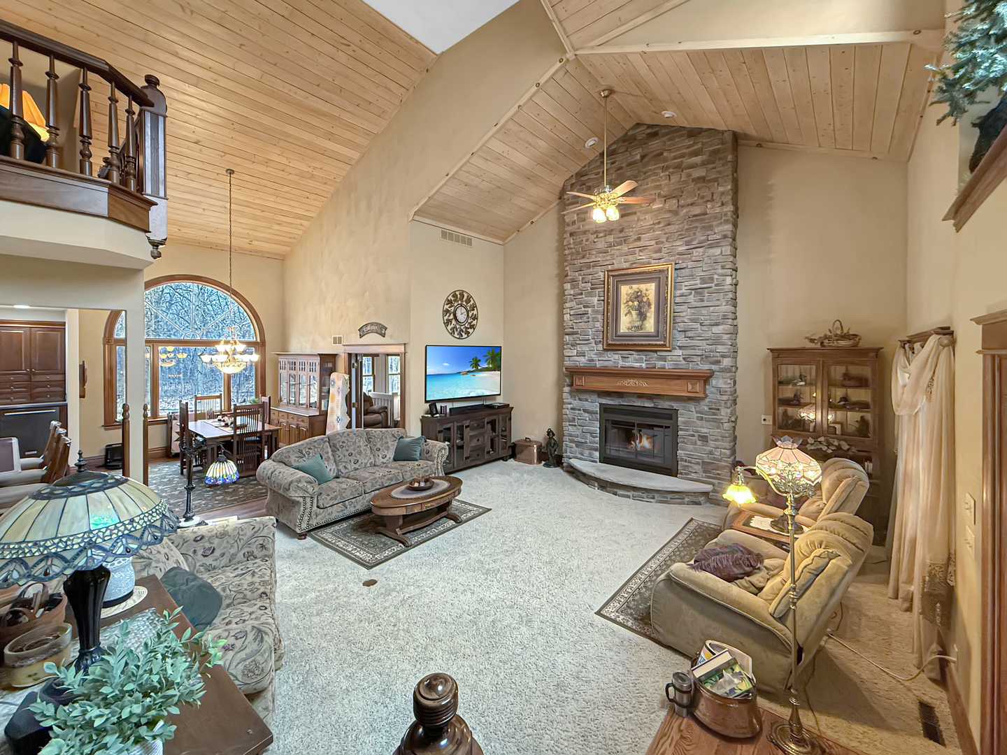 11307 Timber Lane Lena, IL 61048 - Photo 40 of 85 a living room with furniture a fireplace and gym equipment