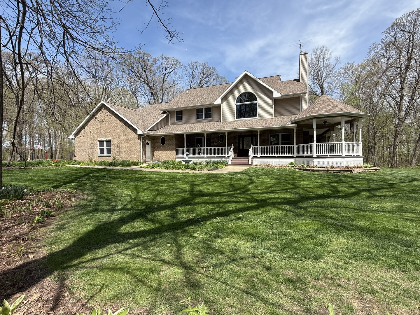 11307 Timber Lane Lena, IL 61048 - Photo 85 of 85 a front view of a house with a yard table and chairs