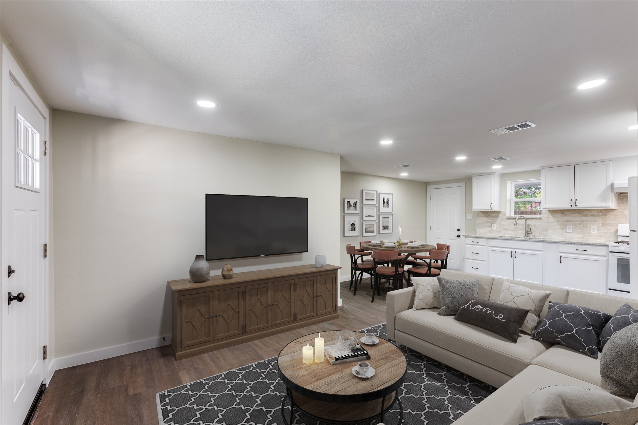 1118 Spur Street Austin, TX 78721 - Photo 3 of 21 Virtually Staged. An inviting open-concept layout seamlessly merges living, dining, and culinary spaces for modern comfort.