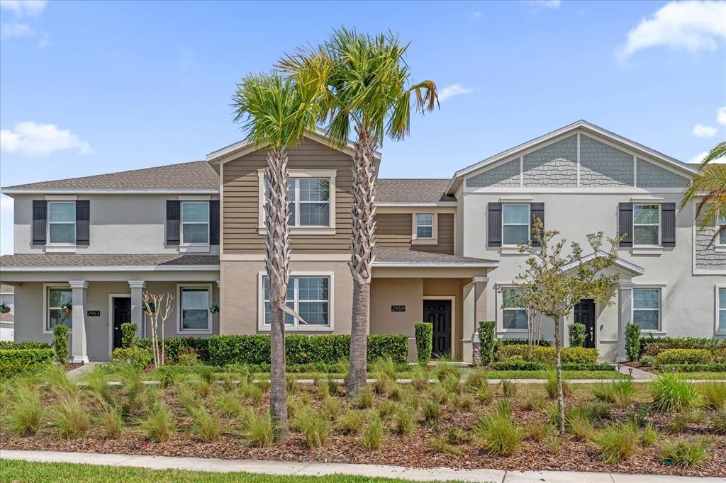 2959 Addison Boulevard St. Cloud, FL 34771 - Photo 1 of 30 a front view of a house with a yard