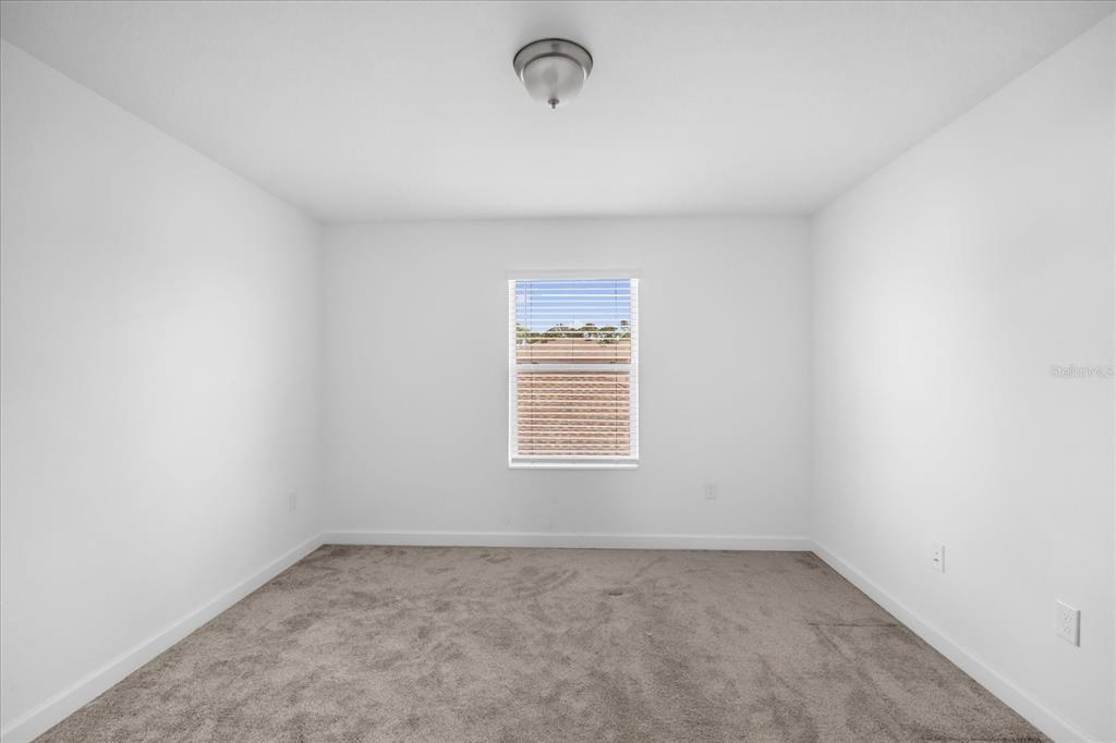 2959 Addison Boulevard St. Cloud, FL 34771 - Photo 12 of 30 an empty room with a window