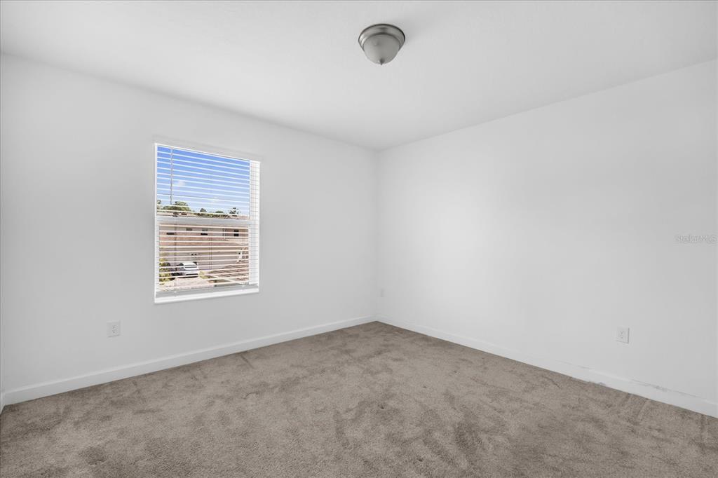 2959 Addison Boulevard St. Cloud, FL 34771 - Photo 14 of 30 an empty room with a window