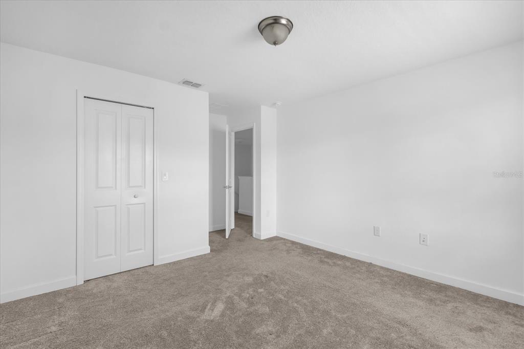 2959 Addison Boulevard St. Cloud, FL 34771 - Photo 15 of 30 a view of an empty room and chandelier fan