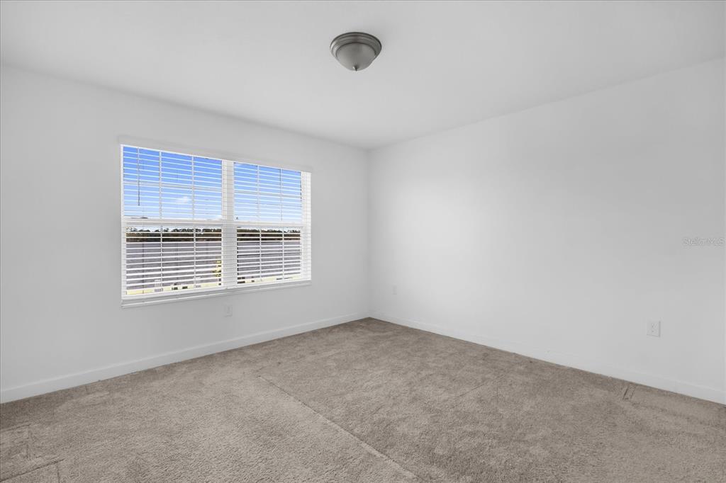 2959 Addison Boulevard St. Cloud, FL 34771 - Photo 16 of 30 a view of an empty room with a window