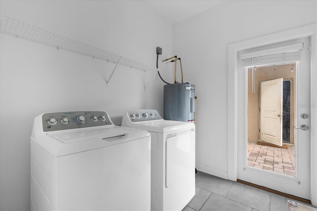 2959 Addison Boulevard St. Cloud, FL 34771 - Photo 20 of 30 a utility room with dryer and washer