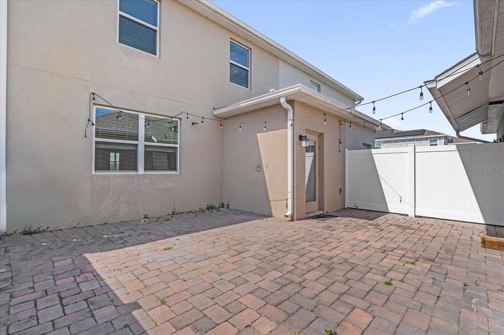 2959 Addison Boulevard St. Cloud, FL 34771 - Photo 21 of 30 a view of a house with a yard