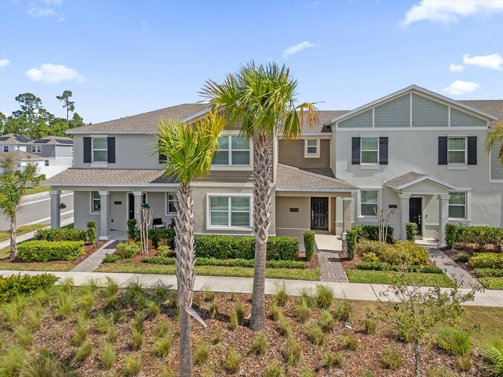 2959 Addison Boulevard St. Cloud, FL 34771 - Photo 24 of 30 a front view of a house with garden