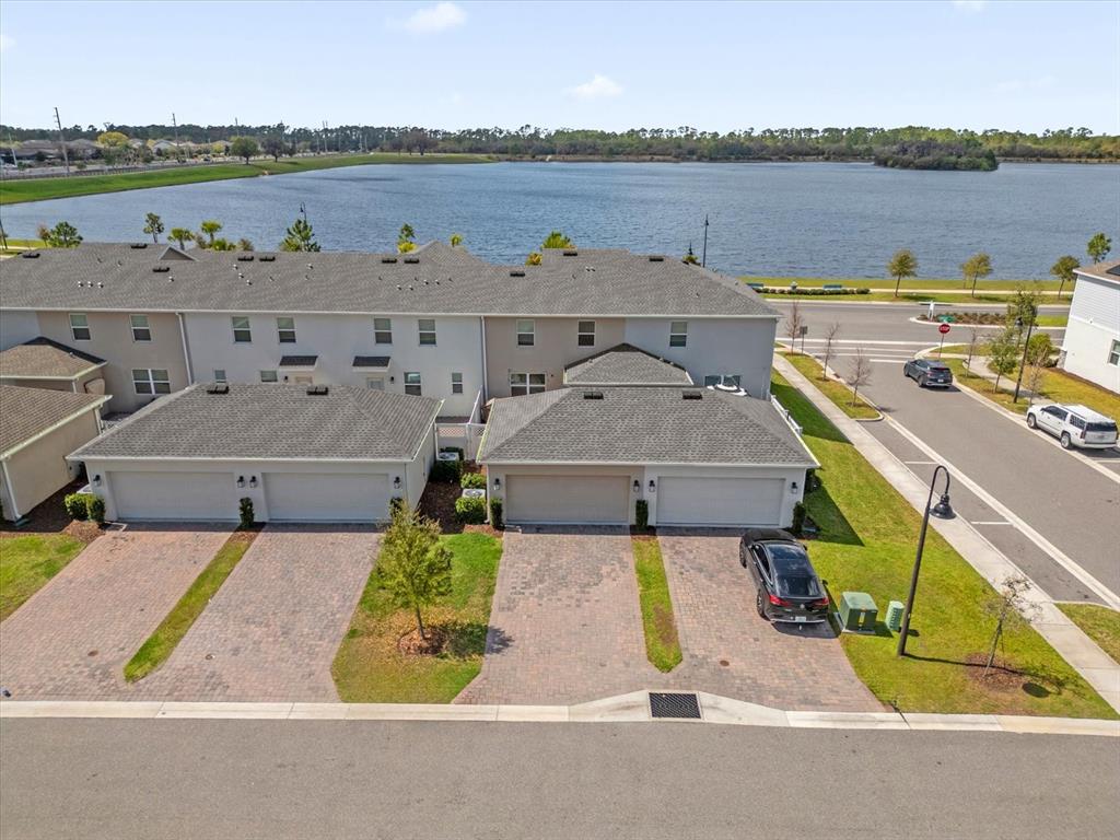 2959 Addison Boulevard St. Cloud, FL 34771 - Photo 25 of 30 an aerial view of a house with a lake and a mountain view