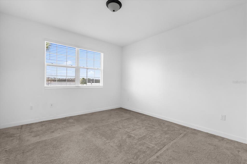 2959 Addison Boulevard St. Cloud, FL 34771 - Photo 9 of 30 an empty room with a window