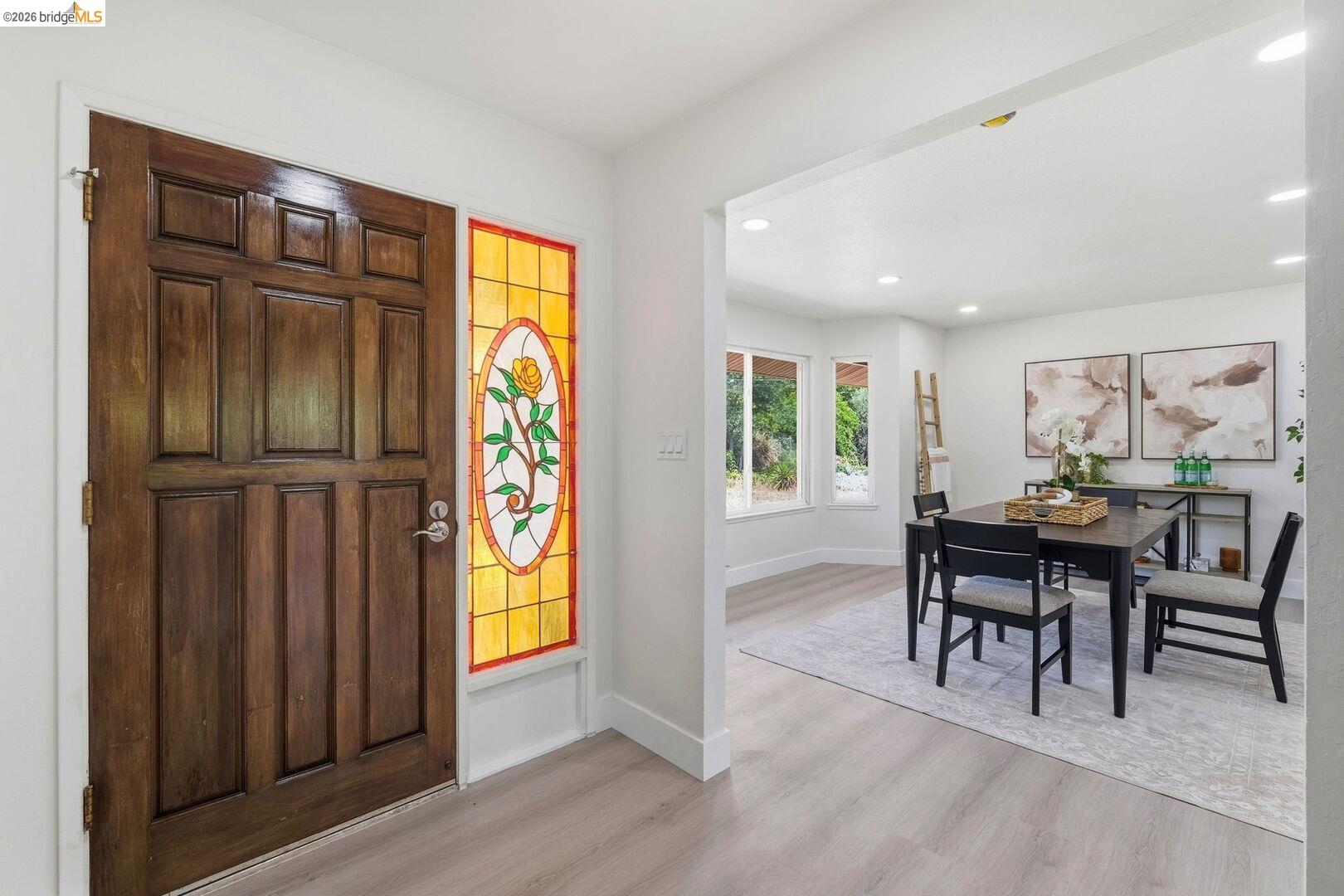 1590 Sunset Road Brentwood, CA 94513 - Photo 6 of 45 Paneled wood entry door with an oval stained-glass sidelight