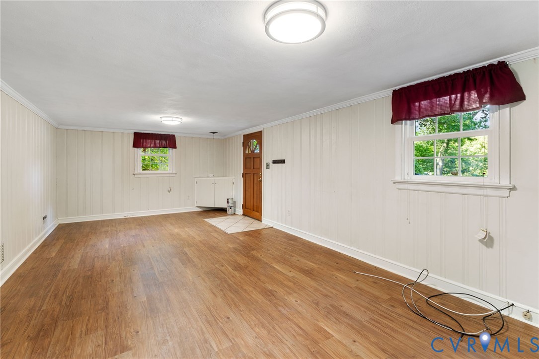 3369 Warner Road Richmond, VA 23225 - Photo 22 of 46 an empty room with wooden floor and windows