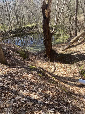 a view of a large body of water with a building in the background