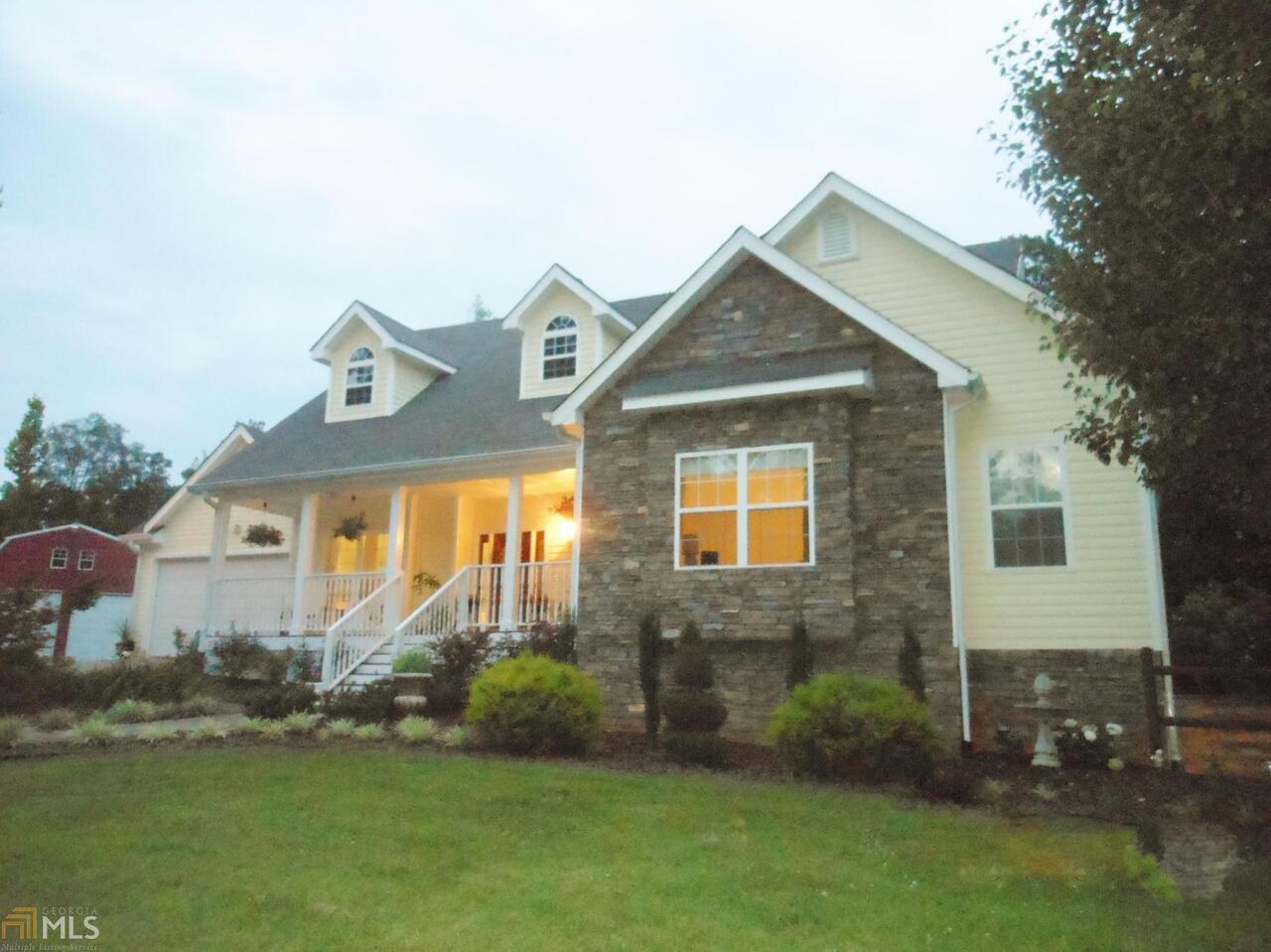 3791 Shady Grove Road Carrollton, GA 30116 - Photo 1 of 1 a front view of a house with a yard and garage