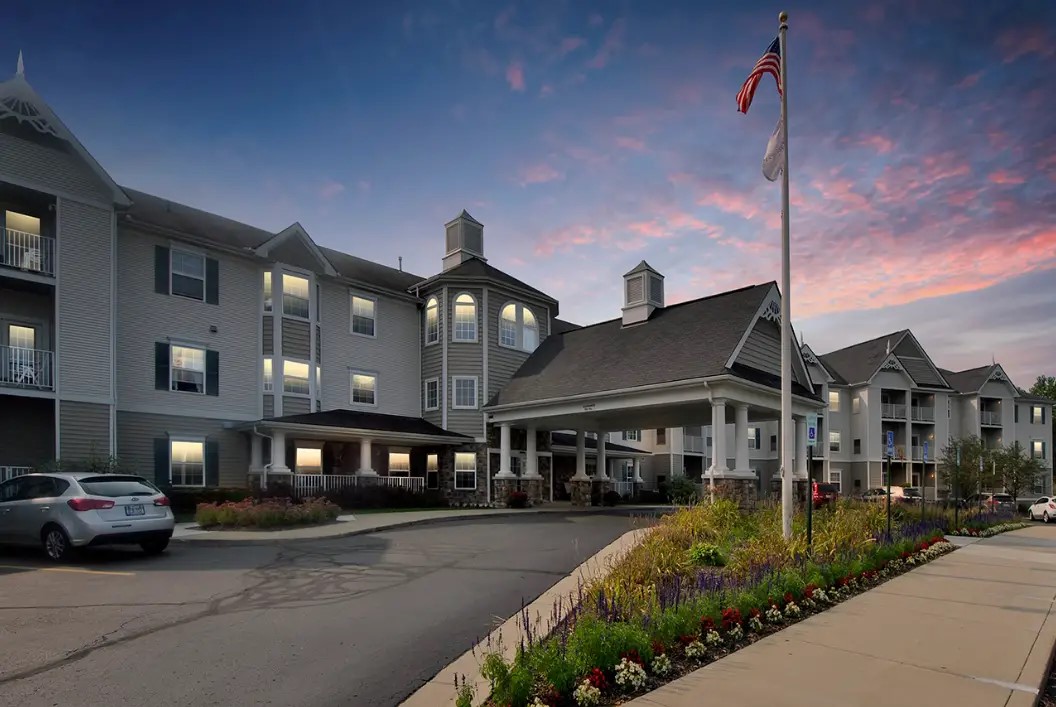 a front view of a building with garden