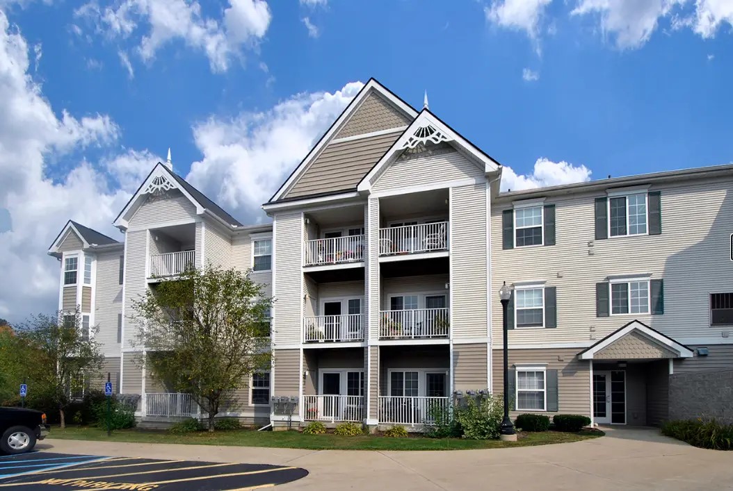 1320 Ashebury Lane Howell, MI 48843 - Photo 3 of 8 a front view of a house with a yard