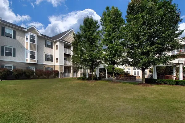 a view of a building with a yard