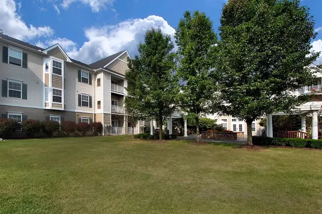 a view of a building with a yard
