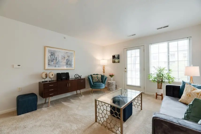 1320 Ashebury Lane Howell, MI 48843 - Photo 6 of 8 a living room with furniture and a window