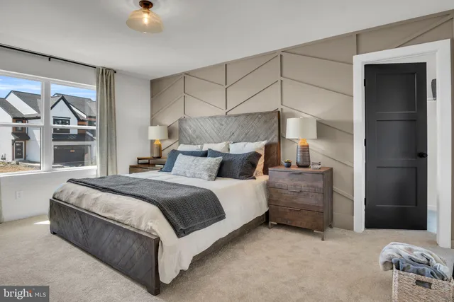 a bedroom with a bed and a view mirror