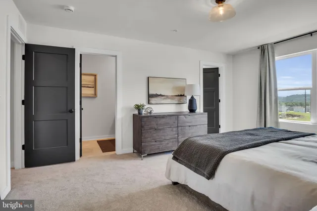 a bathroom with a double vanity sink and mirror