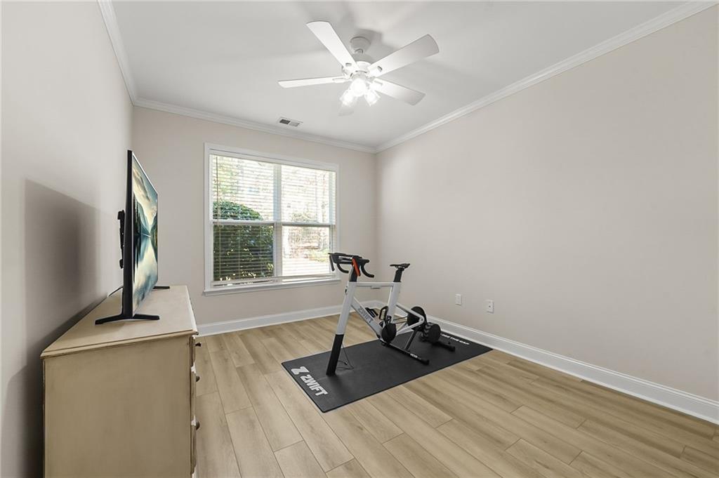 356 Shoal Creek Way Dallas, GA 30132 - Photo 15 of 32 a living room with furniture and a flat screen tv