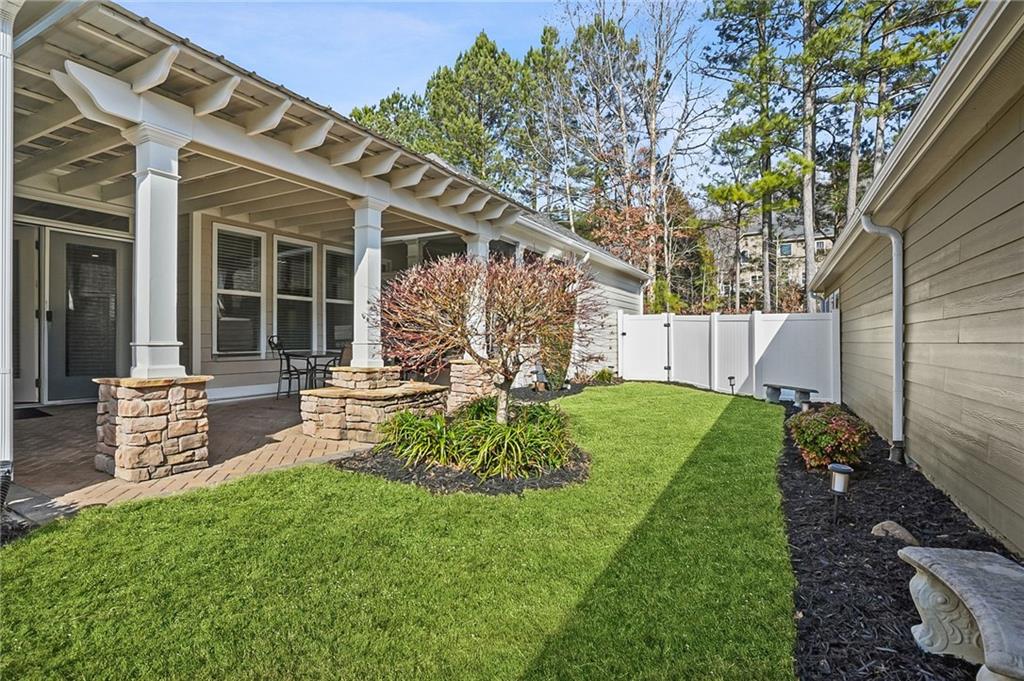 356 Shoal Creek Way Dallas, GA 30132 - Photo 23 of 32 a view of a house with backyard and a tree