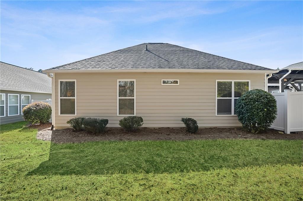 356 Shoal Creek Way Dallas, GA 30132 - Photo 25 of 32 a view of an house with backyard and a tree