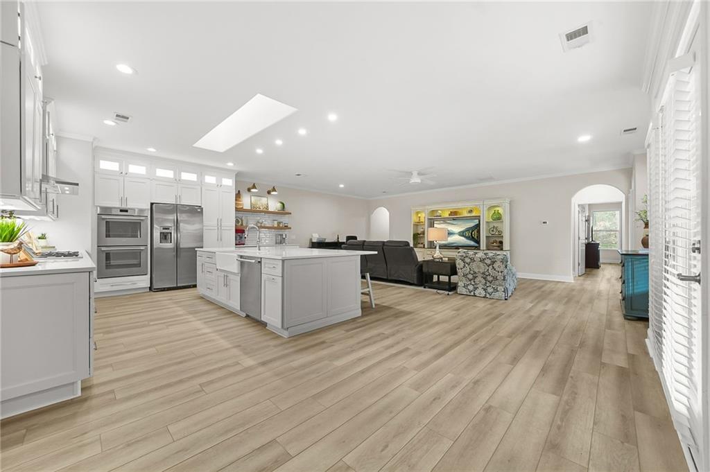 356 Shoal Creek Way Dallas, GA 30132 - Photo 5 of 32 a view of kitchen with furniture and wooden floor