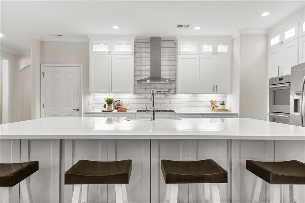 356 Shoal Creek Way Dallas, GA 30132 - Photo 7 of 32 a kitchen with a sink a counter and cabinets