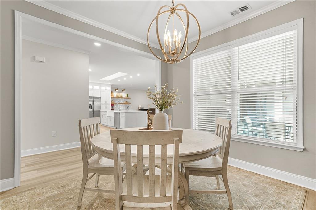 356 Shoal Creek Way Dallas, GA 30132 - Photo 8 of 32 a view of a dining room with furniture and chandelier