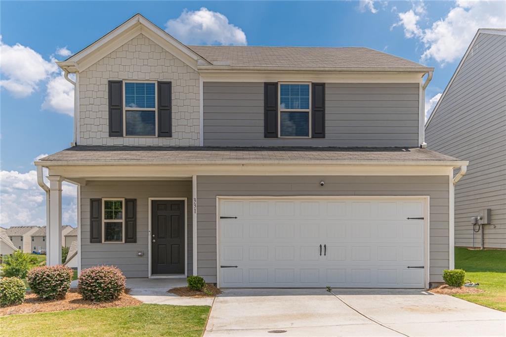 331 Merigold Way Pendergrass, GA 30567 - Photo 1 of 1 a front view of a house with garden