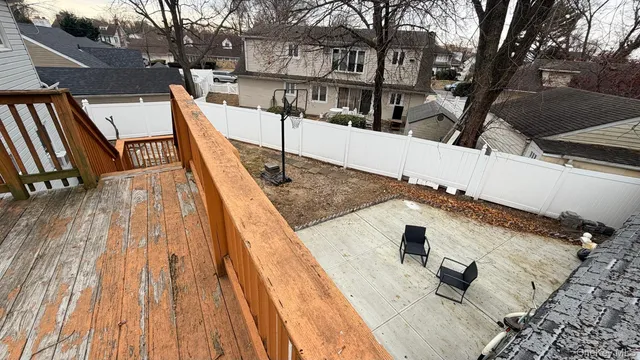 a view of a house with wooden deck