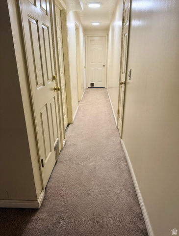 3918 Mapleleaf Way West Jordan, UT 84088 - Photo 6 of 12 Corridor with carpet flooring and baseboards
